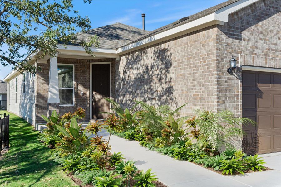 VIRTUAL STAGING, PLANTS HAD NOT BEEN PLANTED AT TIME OF PICTURES