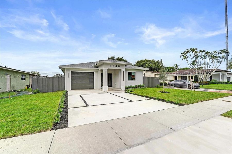 Front exterior of a new home in , West Park, FL, highlighting curb appeal (Image 2). Front exterior of a new home in , West Park, FL, highlighting curb appeal (Image 2).
