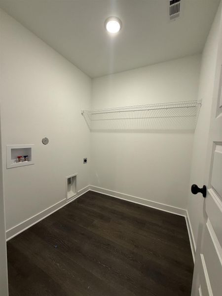 Laundry room with dark wood-style floors, washer hookup, and electric dryer hookup