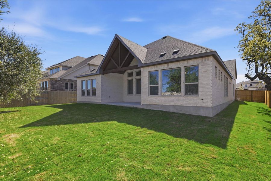 Exterior details and patio area of a home in Oaks at San Gabriel, Georgetown (Image 18).