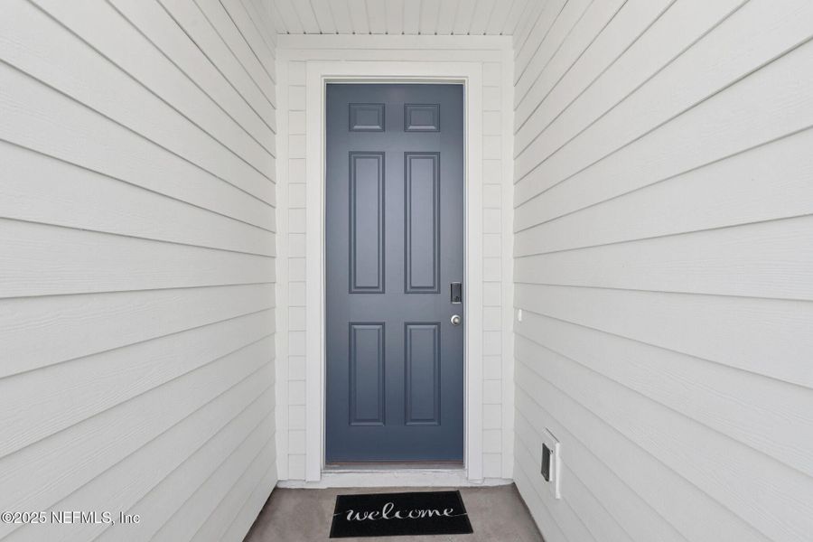 Exterior details and patio area of a home in Lakes at Bella Lago - Signature Series, Green Cove Springs (Image 2).