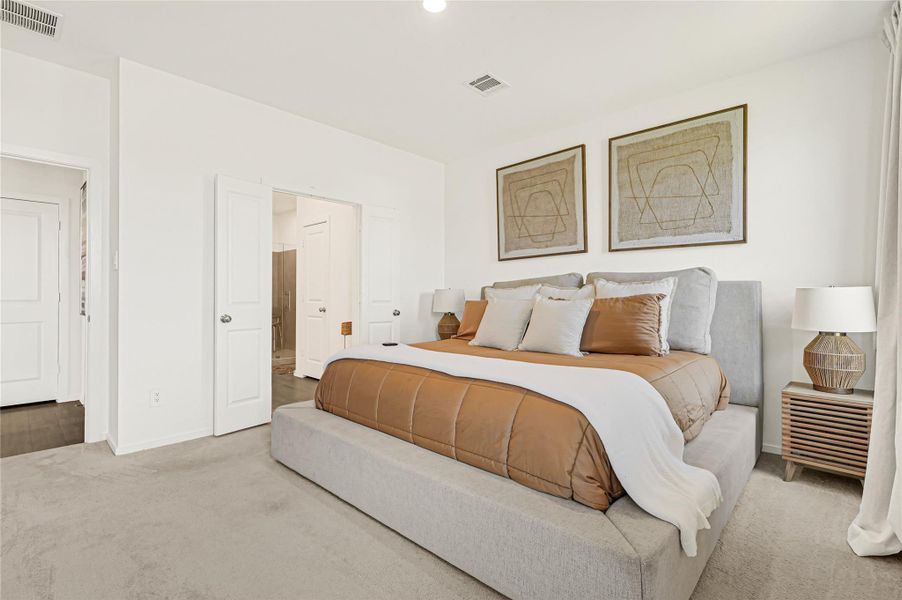 Spacious and inviting bedroom featuring a plush bed with neutral tones, complemented by stylish artwork and ample natural light. Spacious and inviting bedroom featuring a plush bed with neutral tones, complemented by stylish artwork and ample natural light.