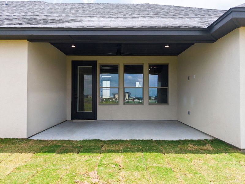 A spacious covered patio awaits, ideal for outdoor leisure and entertaining. A spacious covered patio awaits, ideal for outdoor leisure and entertaining.