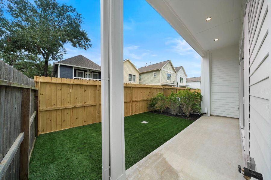 View of large private backyard with artificial turf, perfect for entertaining. (Photos are of a previously completed home. Finishes are subject to change.) View of large private backyard with artificial turf, perfect for entertaining. (Photos are of a previously completed home. Finishes are subject to change.)