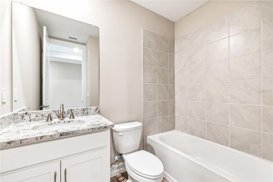Furnished interior view inside a new home in Burnt Store Village, Punta Gorda (Image 9).