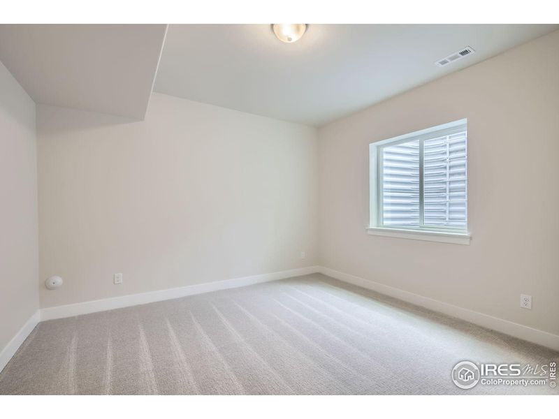 Spacious, unfurnished interior of a new home in RainDance National 60/70, Windsor (Image 18).