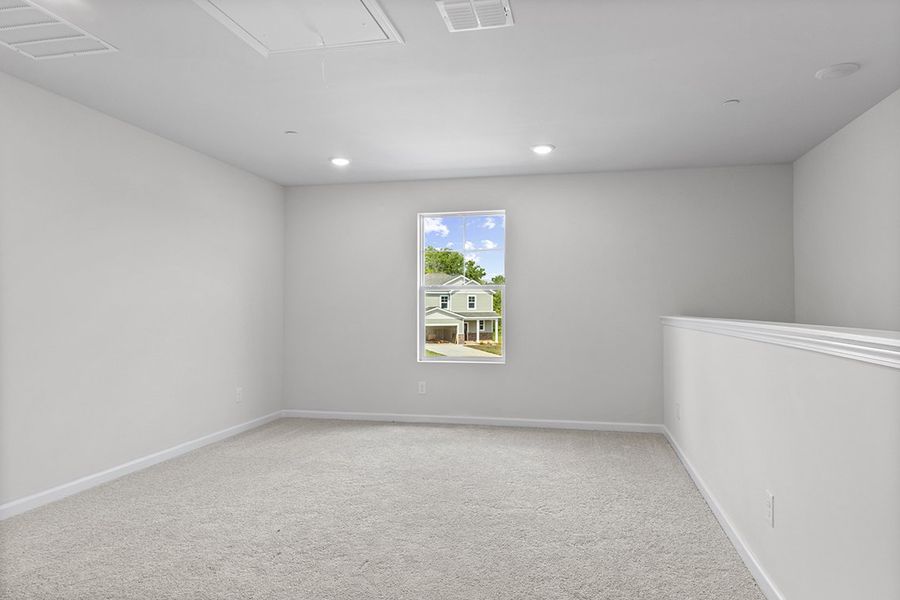 A room with a window and a white wall. A room with a window and a white wall.