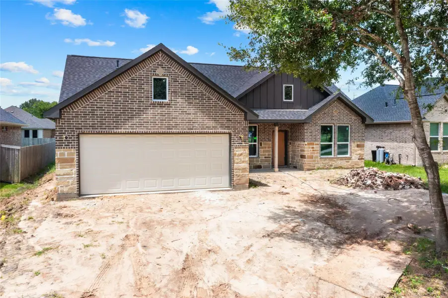 Front exterior of a new home in , Needville, TX, highlighting curb appeal (Image 1). Front exterior of a new home in , Needville, TX, highlighting curb appeal (Image 1).