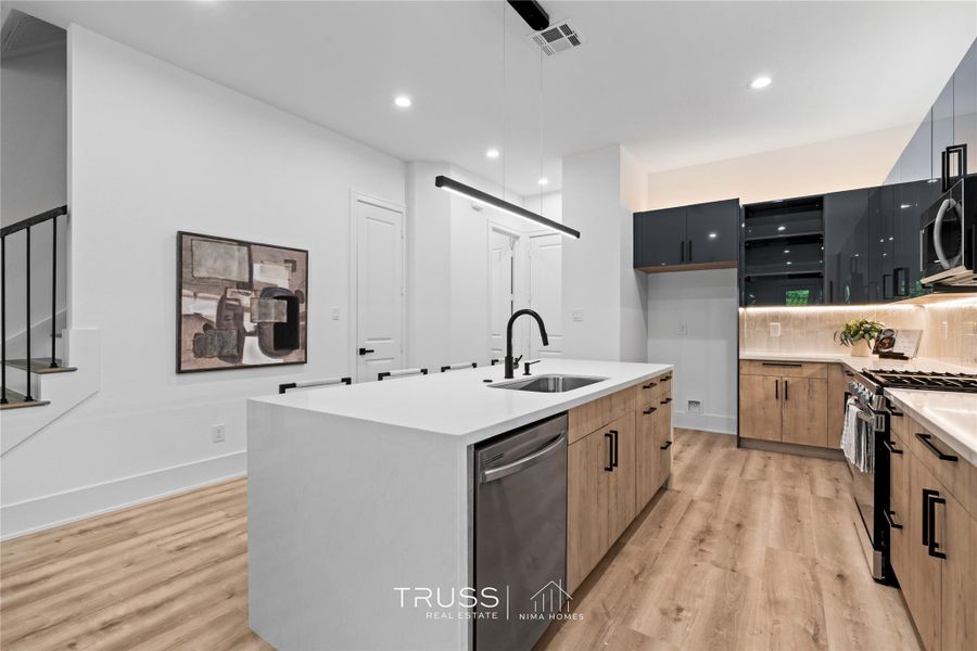 Architectural clarity shines through the open stair railings and clean sightlines, connecting each level in one cohesive design language.