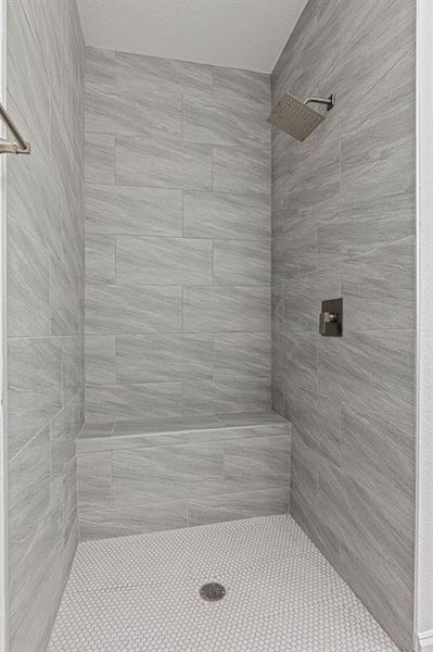 Bathroom with a tile shower