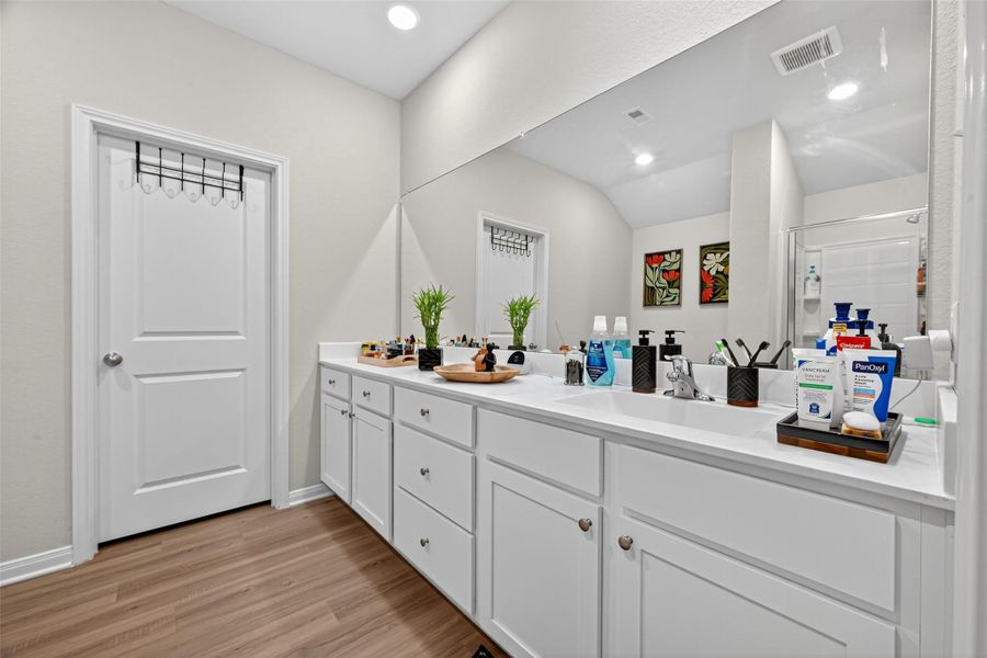 Wide mirror with ample vanity space. Wide mirror with ample vanity space.