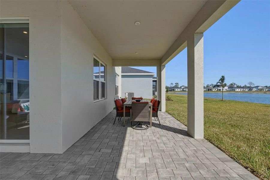 Exterior details and patio area of a home in West Port Single Family Homes, Port Charlotte (Image 4).