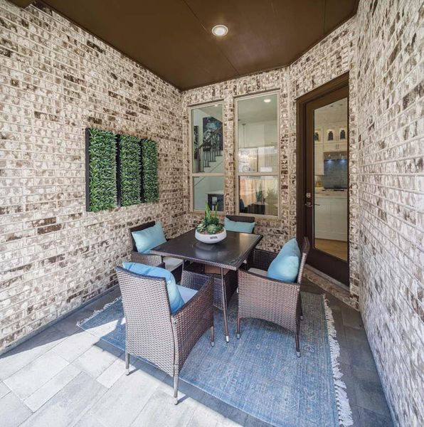 Exterior details and patio area of a home in Woodforest Townhomes, Montgomery (Image 3).