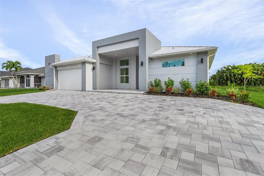 Front exterior of a new home in , Cape Coral, FL, highlighting curb appeal (Image 12).