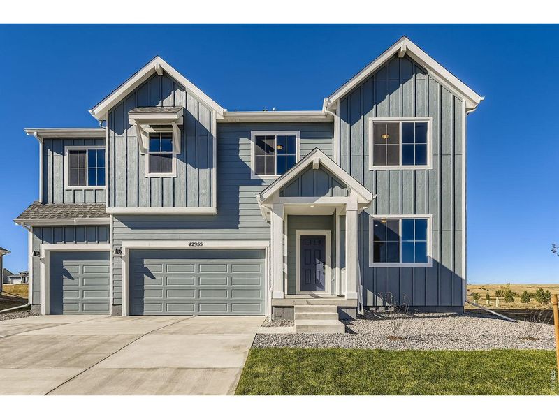 Front exterior of a new home in Farmstead, Berthoud, CO, highlighting curb appeal (Image 1). Front exterior of a new home in Farmstead, Berthoud, CO, highlighting curb appeal (Image 1).