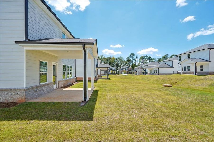 Front exterior of a new home in Martin Springs - Reserve Series, Lawrenceville, GA, highlighting curb appeal (Image 2). Front exterior of a new home in Martin Springs - Reserve Series, Lawrenceville, GA, highlighting curb appeal (Image 2).