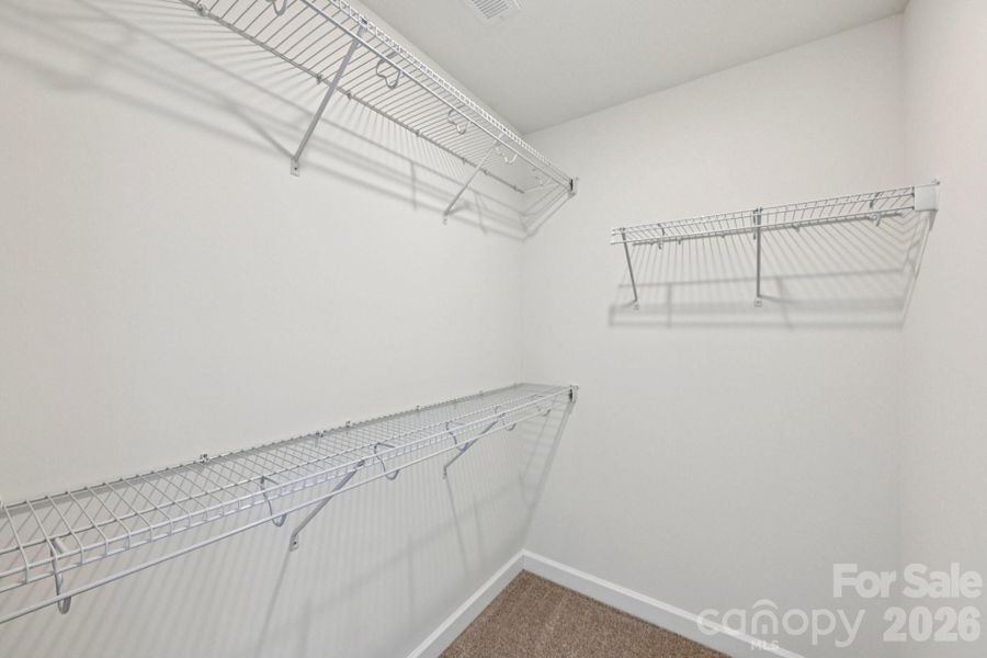 Spacious, unfurnished interior of a new home in Meadows at Wilson Farms - The Summit Series, Fort Mill (Image 15). Spacious, unfurnished interior of a new home in Meadows at Wilson Farms - The Summit Series, Fort Mill (Image 15).