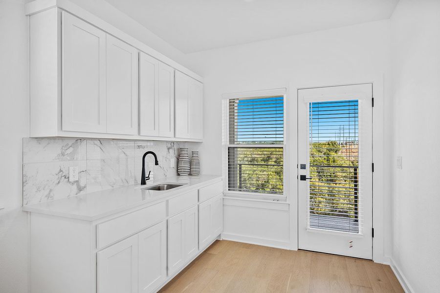 Owners retreat wet bar off upstairs second living area and primary bedroom.