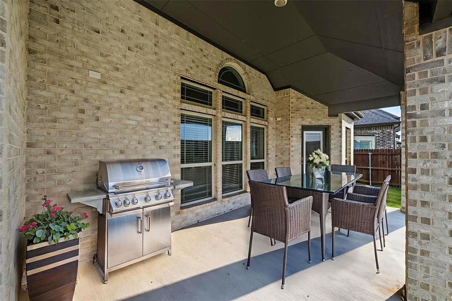 View of patio / terrace with outdoor dining area and area for grilling View of patio / terrace with outdoor dining area and area for grilling