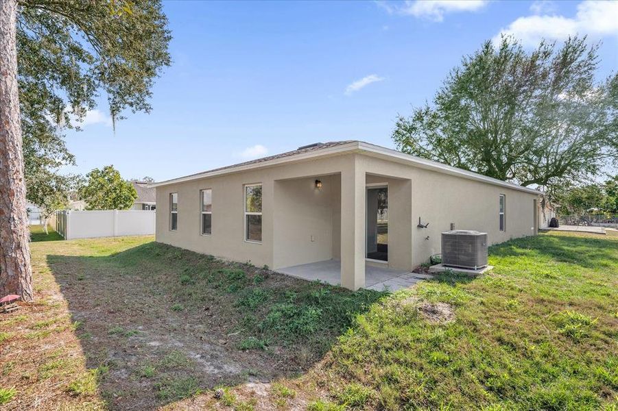 Exterior details and patio area of a home in Poinciana Village, Kissimmee (Image 3).