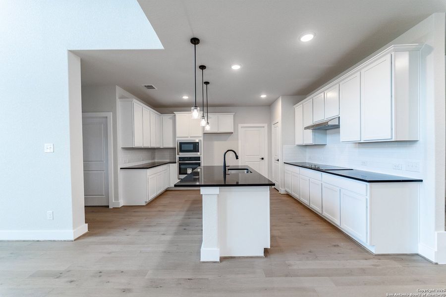 Furnished interior view inside a new home in The Woodlands at Medina Hills, Mico (Image 5).