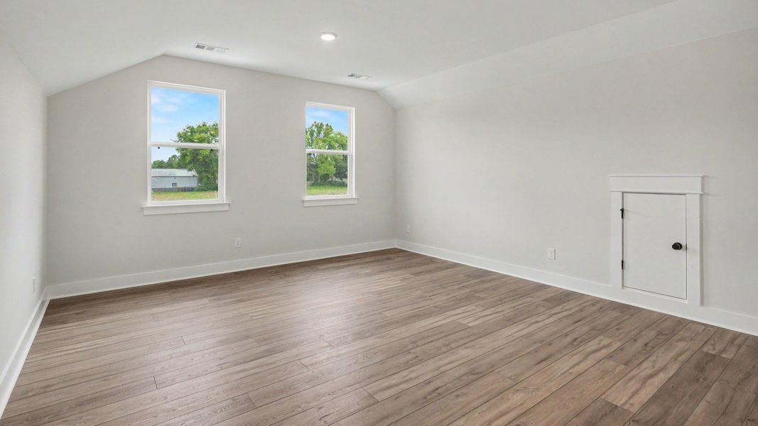Loft area with hard surface flooring with access to bedrooms