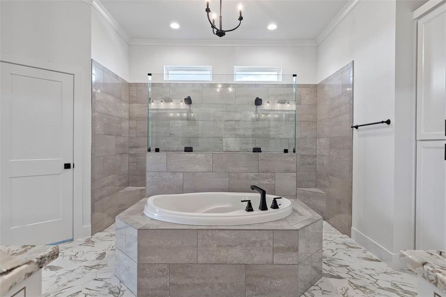 Bathroom featuring tile patterned floors, independent shower and bath, crown molding, and vanity