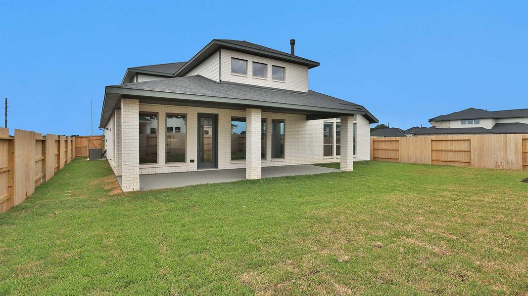 Exterior details and patio area of a home in Legacy Prairie at Katy Court, Katy (Image 2).