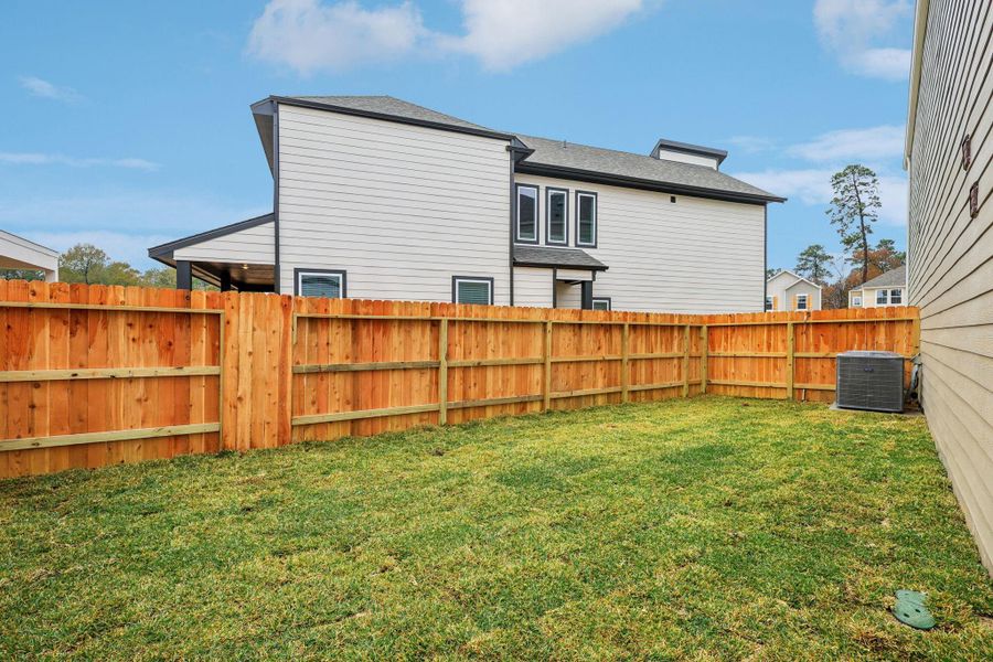 Exterior details and patio area of a home in Pinewood Trails - City Series, Atascocita (Image 22).