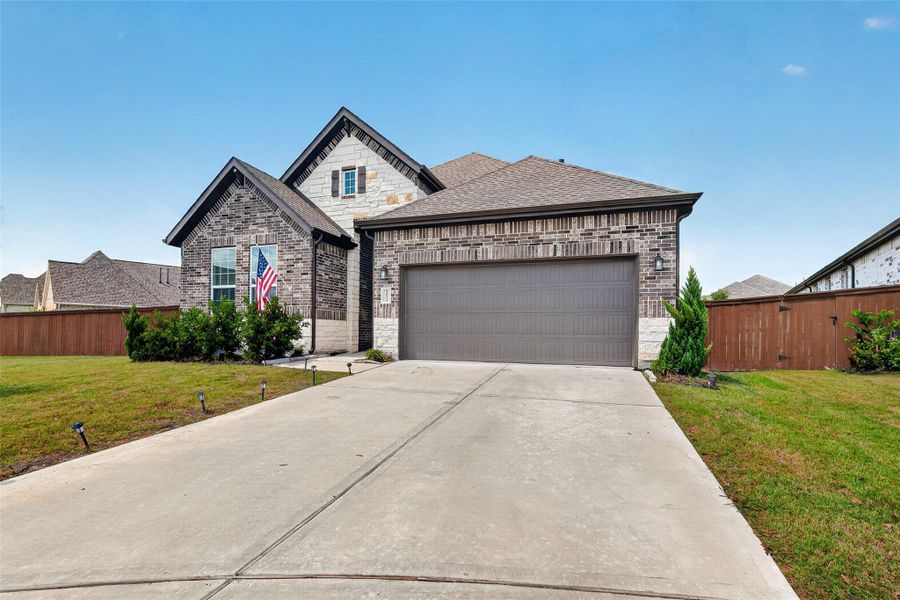 Front exterior of a new home in , Iowa Colony, TX, highlighting curb appeal (Image 20).