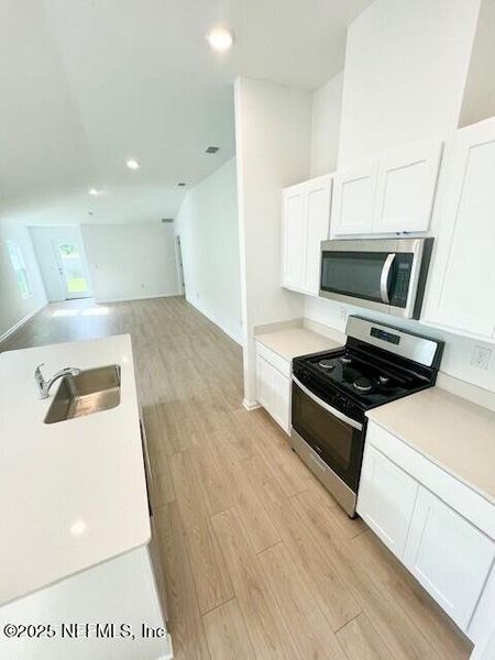 Furnished interior view inside a new home in Grand Reserve, Bunnell (Image 8).
