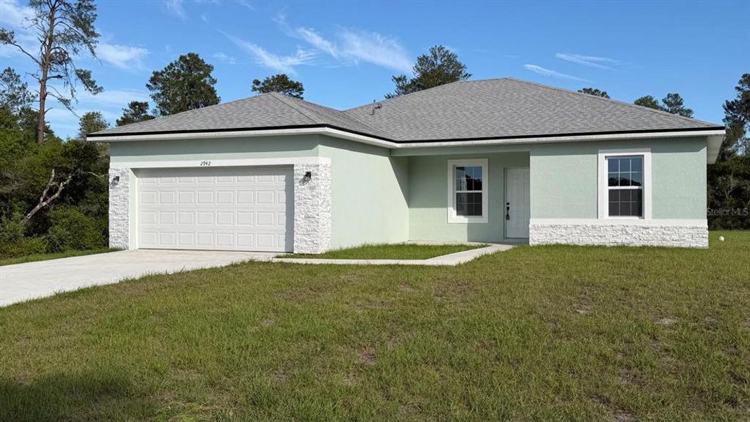 Front exterior of a new home in , Ocala, FL, highlighting curb appeal (Image 14).