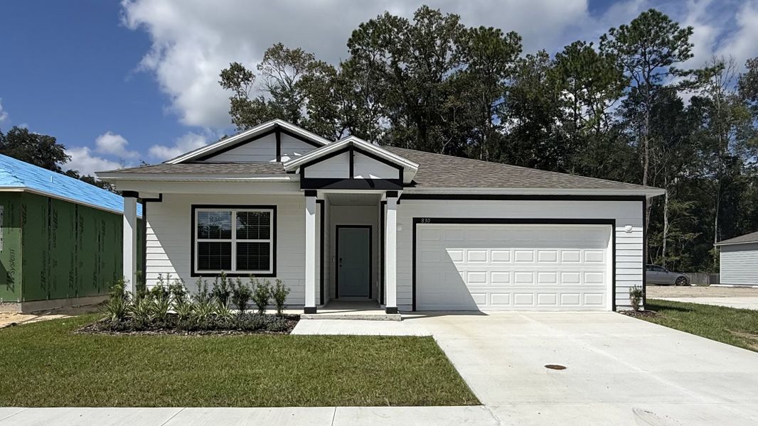 Front exterior of a new home in Oakhaven Walk, Gainesville, FL, highlighting curb appeal (Image 1). Front exterior of a new home in Oakhaven Walk, Gainesville, FL, highlighting curb appeal (Image 1).