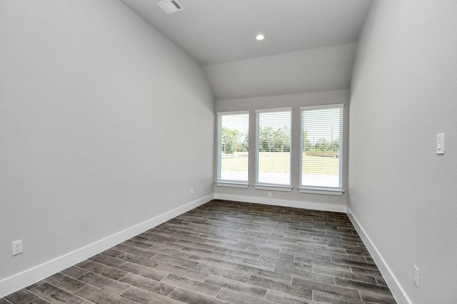 Create lasting memories with your family and friends at the dining table! This expansive dining room showcases sophisticated flooring, custom paint, and seamlessly connects to the family room and kitchen, providing an open and inviting atmosphere. Sample photo of completed home with similar floor plan. Actual colors and selections may vary. Create lasting memories with your family and friends at the dining table! This expansive dining room showcases sophisticated flooring, custom paint, and seamlessly connects to the family room and kitchen, providing an open and inviting atmosphere. Sample photo of completed home with similar floor plan. Actual colors and selections may vary.