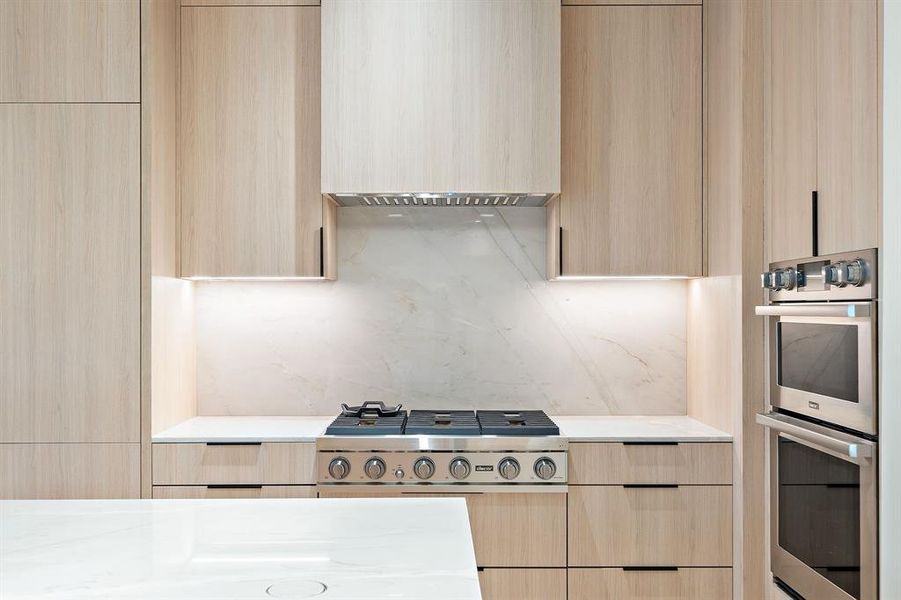 Dacor professional grade appliances include a gas cooktop, vent, built-in oven and microwave!