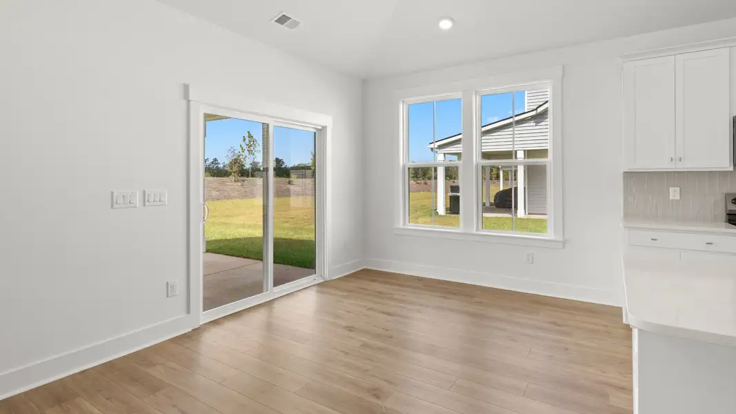 Dining space with natural light and backyard access for easy entertaining. Dining space with natural light and backyard access for easy entertaining.