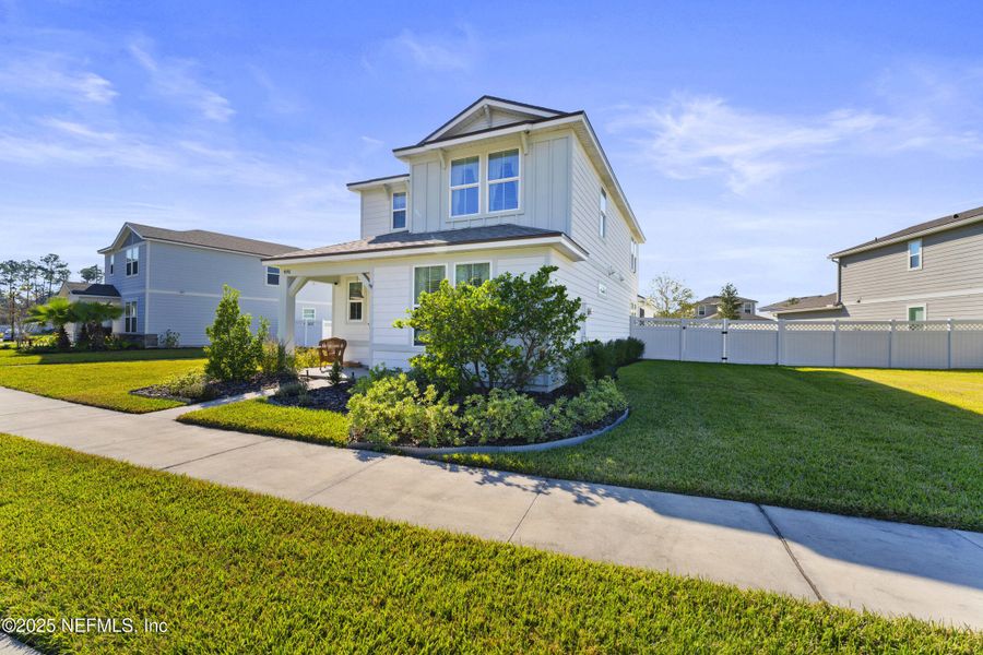Front exterior of a new home in Bradley Pond, Jacksonville, FL, highlighting curb appeal (Image 27).