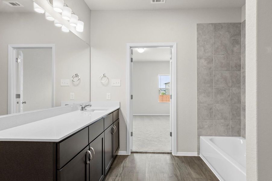 Furnished interior view inside a new home in Oaks at San Gabriel, Georgetown (Image 6).