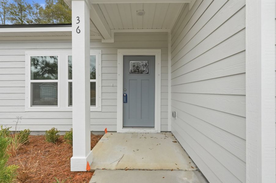 Exterior details and patio area of a home in Live Oak Cottages, Freeport (Image 3).