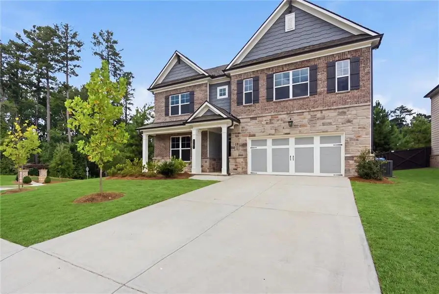 Front exterior of a new home in , Lawrenceville, GA, highlighting curb appeal (Image 2). Front exterior of a new home in , Lawrenceville, GA, highlighting curb appeal (Image 2).