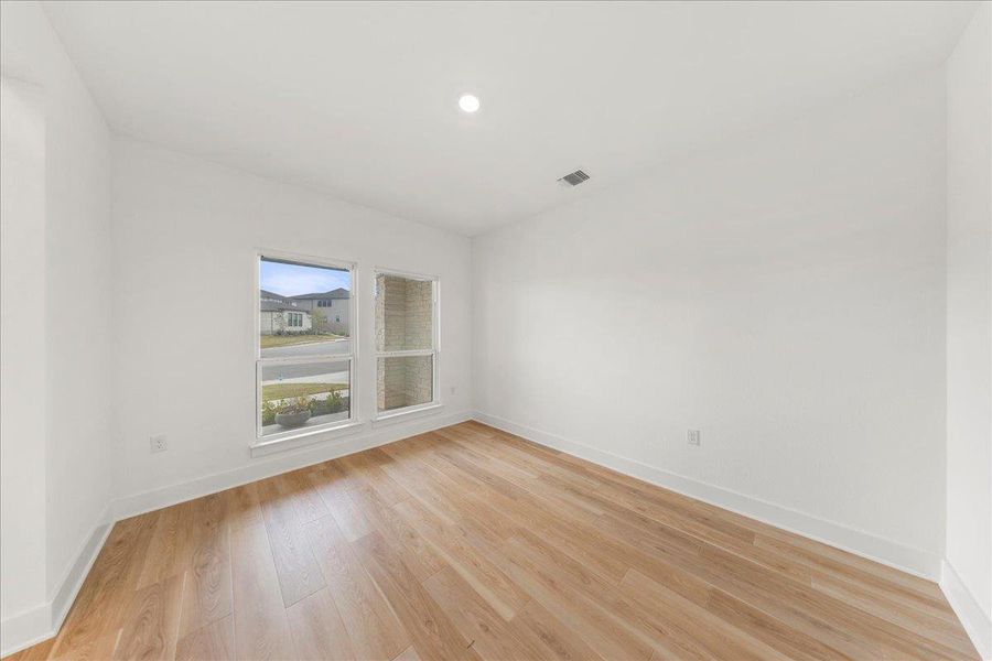 Spare room featuring light wood-style flooring and recessed lighting Spare room featuring light wood-style flooring and recessed lighting
