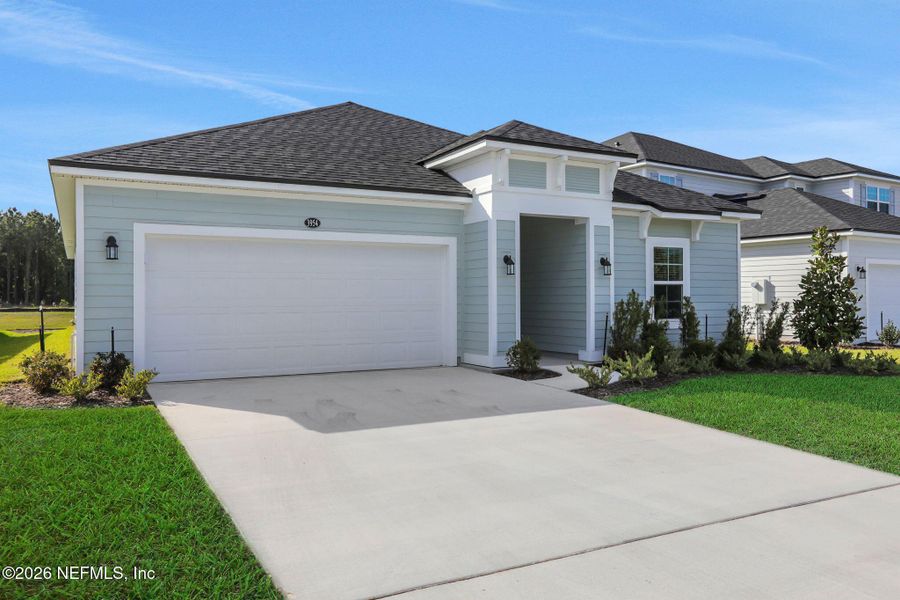 Front exterior of a new home in Amberly, Green Cove Springs, FL, highlighting curb appeal (Image 23).
