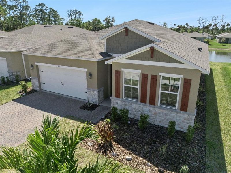 Front exterior of a new home in , New Smyrna Beach, FL, highlighting curb appeal (Image 23).