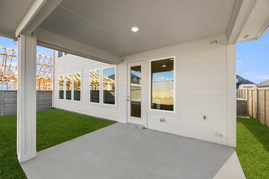 Exterior details and patio area of a home in Treeline, Justin (Image 19).