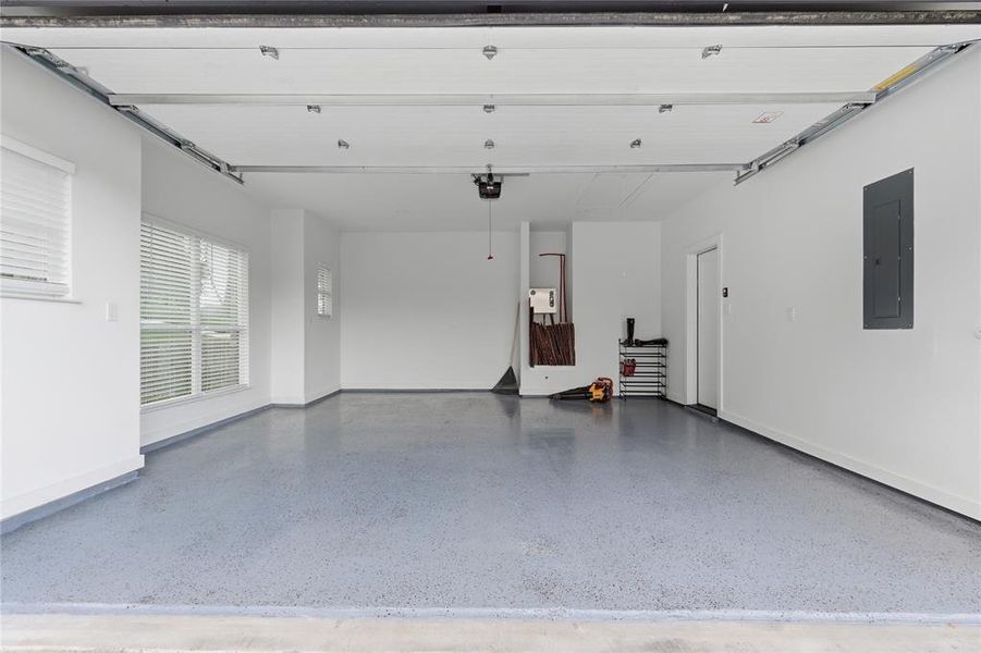 Spacious garage with light gray epoxy flooring