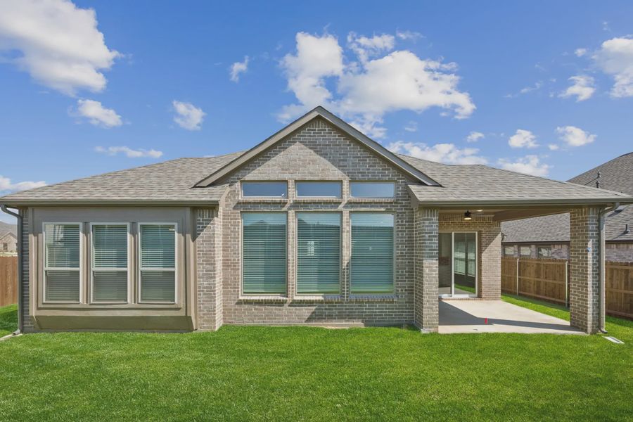 Exterior details and patio area of a home in Oaks of North Grove, Waxahachie (Image 3).