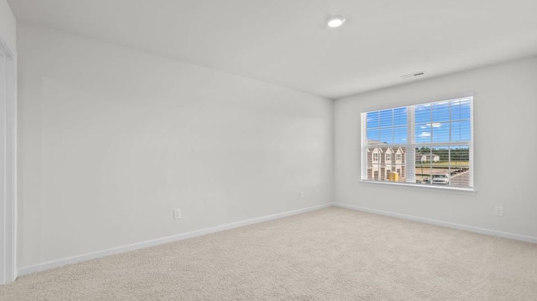 Spacious, unfurnished interior of a new home in The Townes at Ridgewood Farms, Winterville (Image 24).