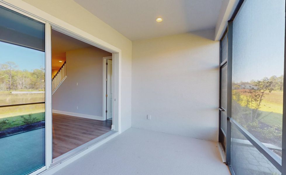 Exterior details and patio area of a home in Woodhaven, Port Orange (Image 17).