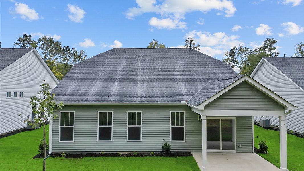 Refined rear exterior with a stylish covered porch for dining, relaxing, or entertaining