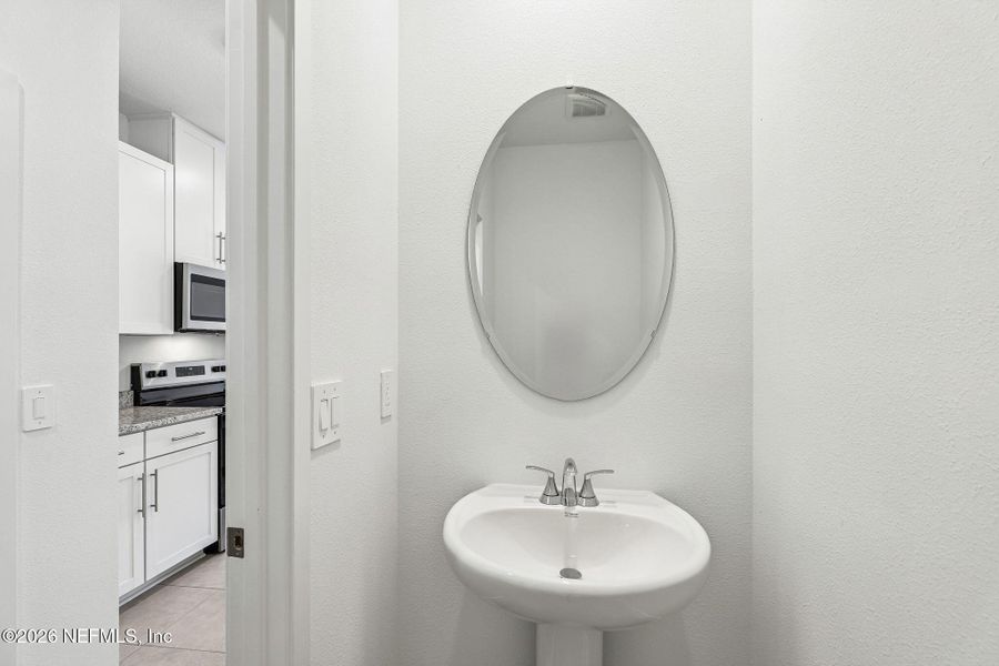 Furnished interior view inside a new home in The District at Oakleaf - The Commons, Middleburg (Image 9).
